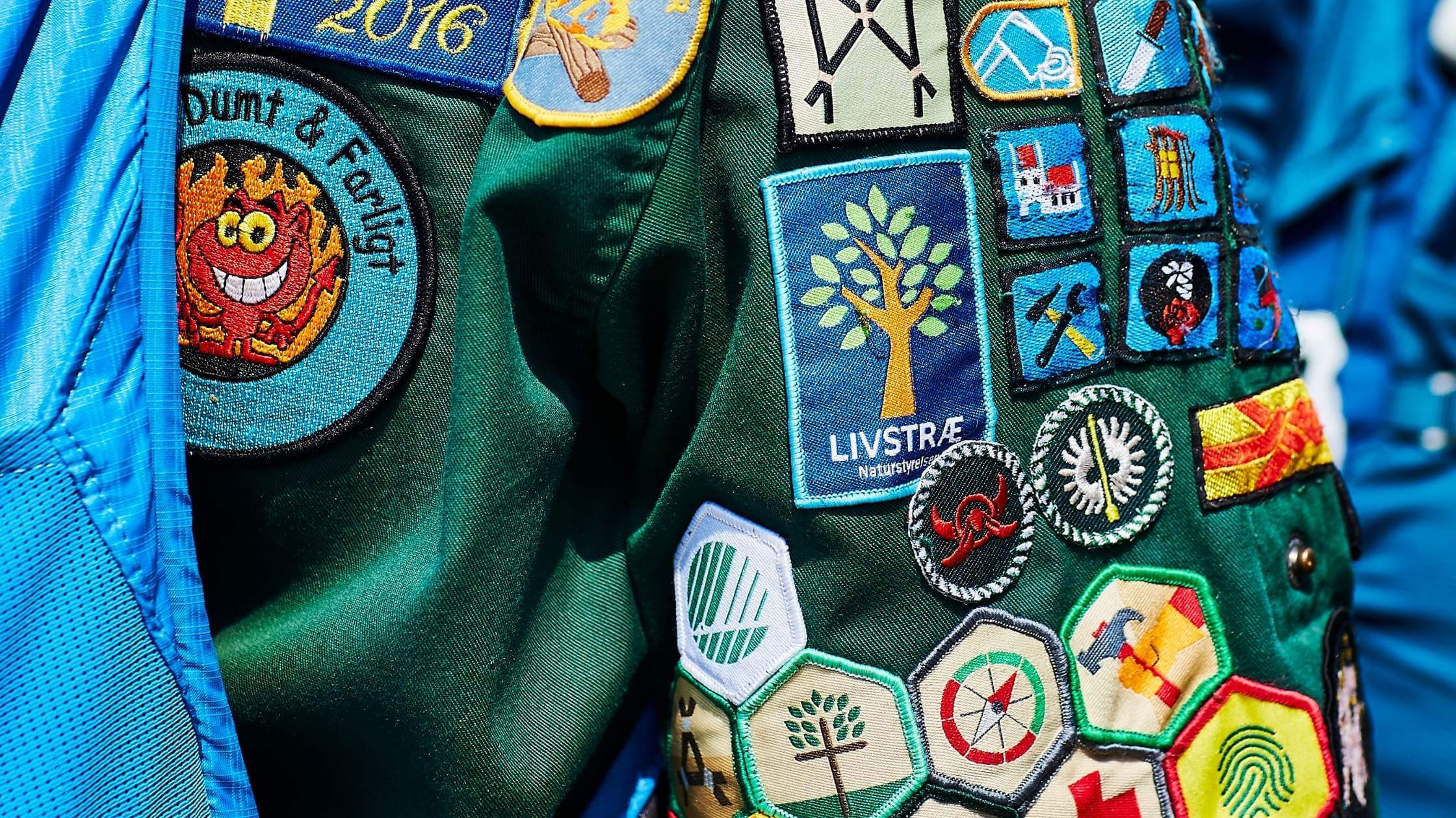 close up of girl scout badges