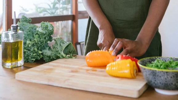 cropped image of someone chopping vegetables